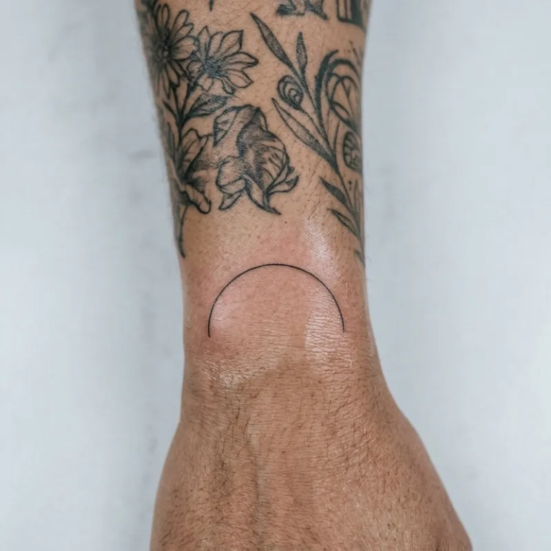Black and grey botanical tattoo